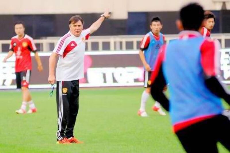 Jose Antonio Camacho, the Spaniard, takes a training session with the China national team, who face Saudi Arabia today. AP Photo