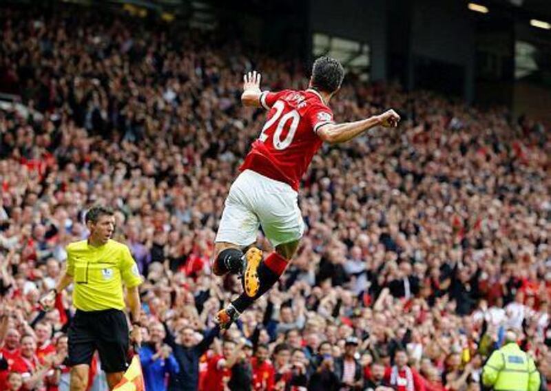 Manchester United's Robin van Persie celebrates after scoring a goal against West Ham United during their English Premier League soccer match at Old Trafford in Manchester, northern England September 27, 2014. REUTERS/Darren Staples