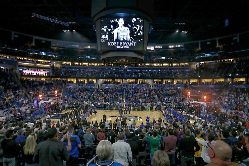 Fans honor the memory of Kobe Bryant with a moment of silence before an NBA basketball game between the Orlando Magic and the Los Angeles Clippers in Orlando. AP Photo