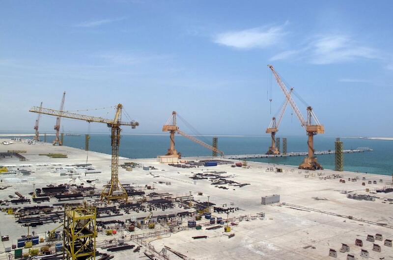 Cranes stand at a massive drydock and ship repair facility in Oman's Duqm Special Economic Zone. Fatma Alarimi / Reuters