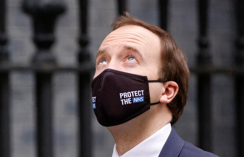 British Health Secretary Matt Hancock walks outside Downing Street in London. Reuters