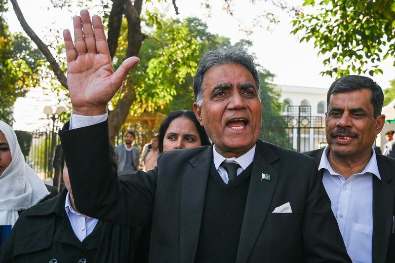 Former military ruler Pervez Musharraf's lawyer Akhtar Shah (C) speaks to the members of the media after a verdict outside a special court in Islamabad.  AFP