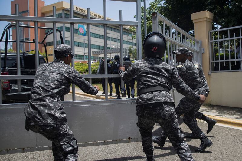 Police close the gate of the ministry offices. AFP