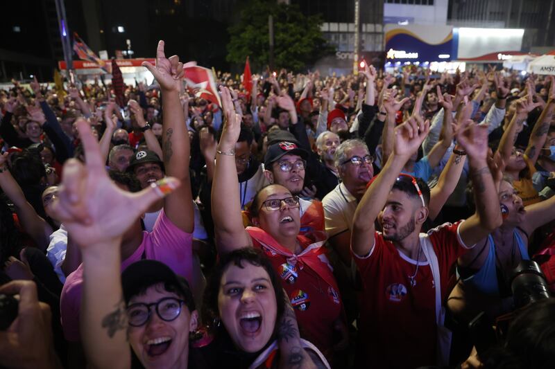 Lula supporters in Sao Paulo. The race for the presidency goes to the second-round vote on October 30. EPA