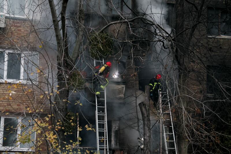 Firefighters work to put out a fire in a residential building hit by a Russian strike. Reuters