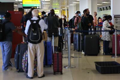 People wait in line to check-in for their flights in Newark, New Jersey on September 02. Getty Images / AFP