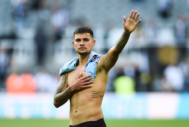 Newcastle's Bruno Guimaraes waves to the crowd. EPA