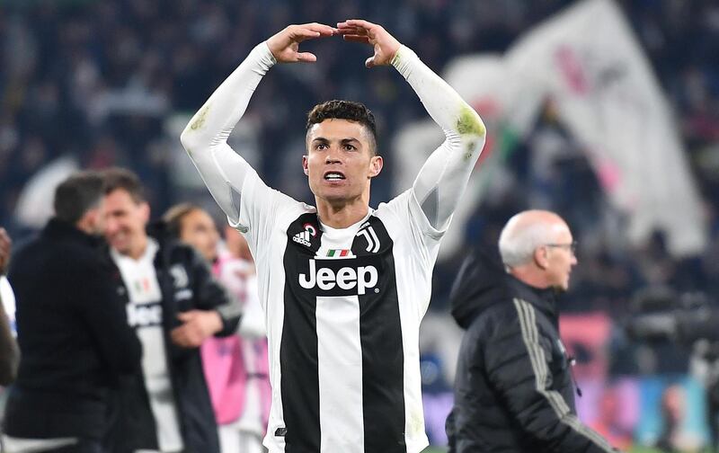 Juventus' Cristiano Ronaldo celebrates after scoring a penalty to make it 3-0 on the night and send the Italian side through to the Champions League quarter-finals 3-2 on aggregate. AFP