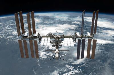 A view of the International Space Station backdropped by the limb of the Earth