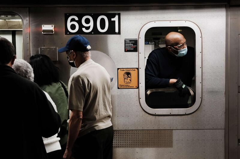 NEW YORK, NEW YORK - APRIL 13: People move through a New York City subway station on April 13, 2021 in New York City. The Metropolitan Transportation Authority (MTA) announced that more than two million people rode the train last Thursday, the highest daily number since the coronavirus (COVID-19) pandemic struck New York.   Spencer Platt/Getty Images/AFP
== FOR NEWSPAPERS, INTERNET, TELCOS & TELEVISION USE ONLY ==
