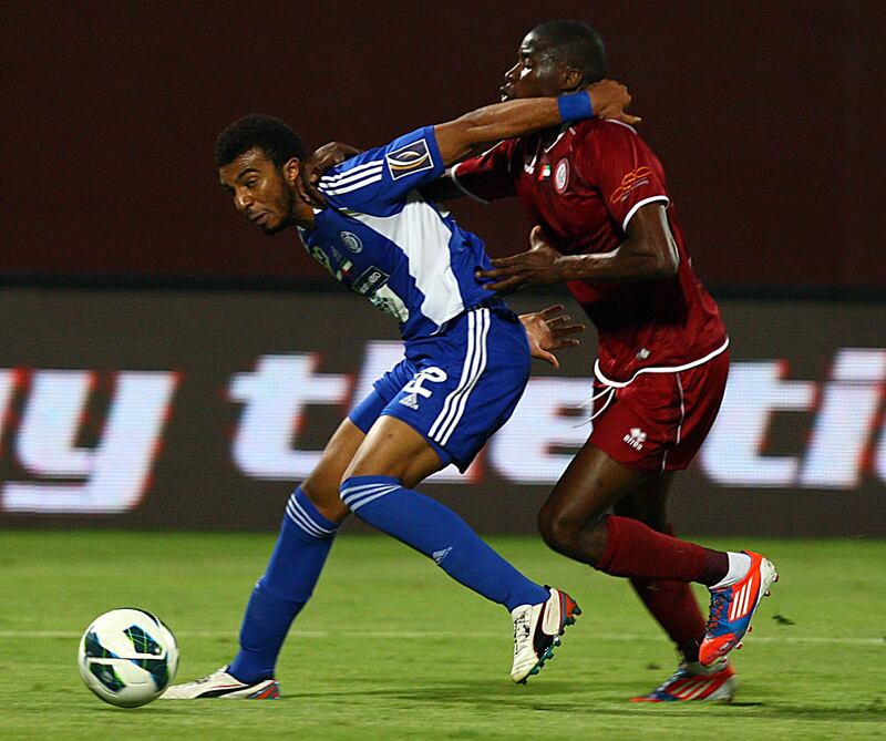 Abu Dhabi, United Arab Emirates- April, 14,  2013:   (L) Mahmoud Darwish of Al Nasr and  (R)  Marcelo Silva of Al Wahda in action during tthe Etisalat Pro-League match between Al Wahda vs Al Nasr at the Al Nahyan Stadium  in Abu Dhabi.  (  Satish Kumar / The National ) For Sports