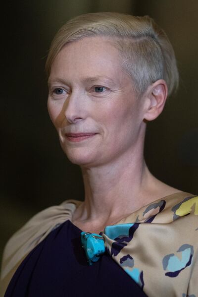 epa07143855 British actress Tilda Swinton poses for photographs during the opening of the exhibition 'Spitzmaus Mummy in a Coffin and Other Treasures from the Kunsthistorisches Museum - Wes Anderson and Juman Malouf' at the Museum of Fine Arts (KHM) in Vienna, Austria, 05 November 2018. The Kunsthistorische Museum invited US filmmaker Wes Anderson and his partner Juman Malouf to curate the exhibition. The exhibition runs from 06 November 2018 until 29 April 2019.  EPA/CHRISTIAN BRUNA
