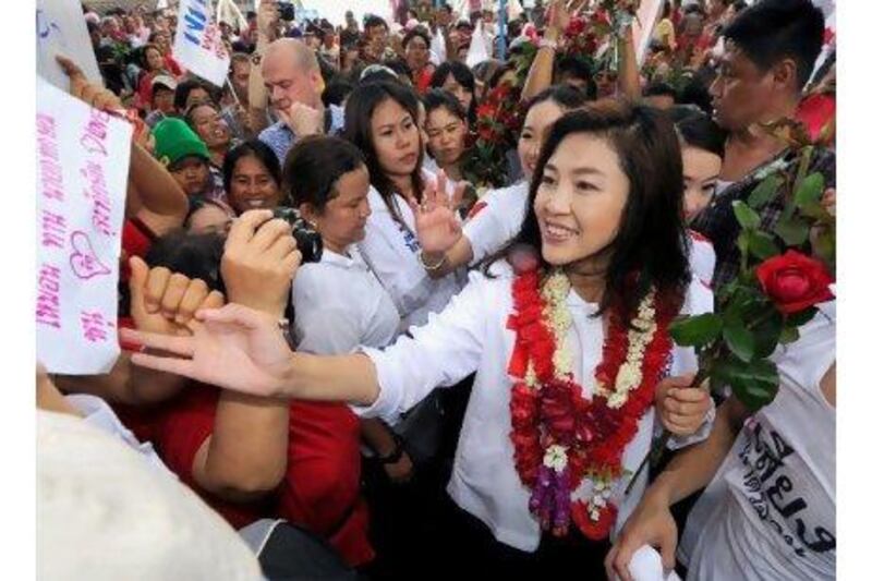 A reader expresses enthusiasm for Yingluck Shinawatra, shown campaigning last month and subsequently Thailand's election winner; she is expected to become the country's prime minister. Pornchai Kittiwongsakul / AFP
