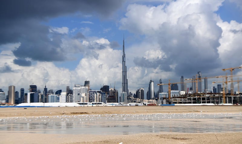Dark clouds over the skyline of Dubai with Burj Khalifa, the world’s tallest building. AFP