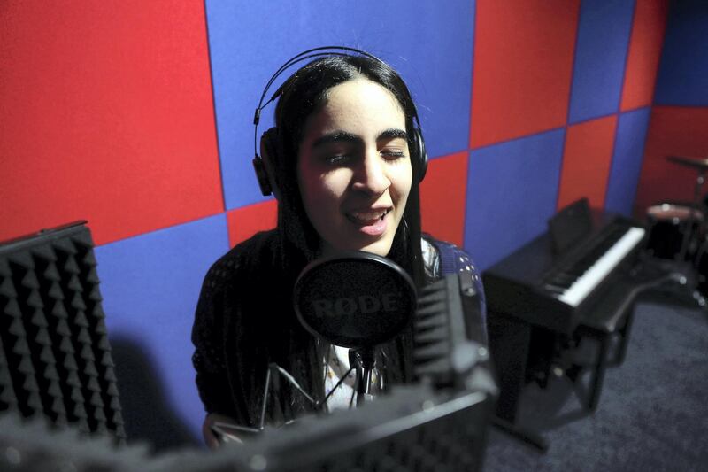 DUBAI ,  UNITED ARAB EMIRATES , JULY 1 -2019 :- Sara Al Hashimi, student of KING’s School Al Barsha Dubai, has autism and has managed to win a scholarship to the music college at Berklee singing at the music room at the school campus in Dubai. ( Pawan Singh / The National ) For News. Story by Anam
