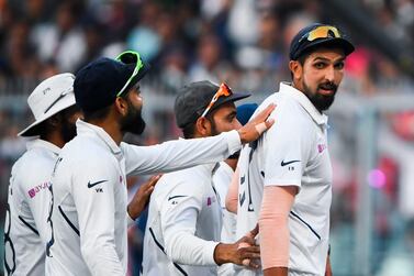 India's Ishant Sharma (R) leaves the field with his teammates at the end of Bangladesh's first innings during the first day of the second Test in Kolkata. AFP