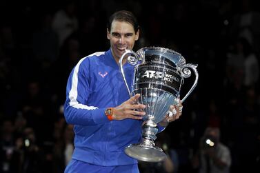 Rafael Nadal poses with his trophy after being announced as world No 1 despite going out of the ATP World Tour Finals in London. Getty