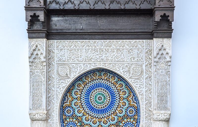 The mosque features complex stonework, ornate wood carvings, white marble floors and Zellige tiles.