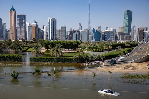 An abandoned car submerged in floodwater after heavy rain in Dubai on April 16. AP