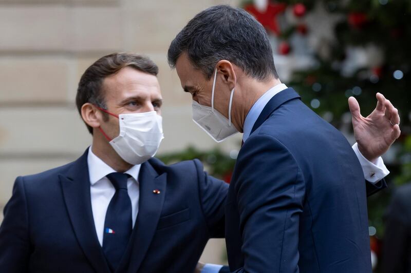 Macron greets Spanish Prime Minister Pedro Sanchez in Paris, on 14 December. EPA