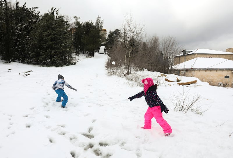 Children play in the snow in Sawfar village, Lebanon. Reuters
