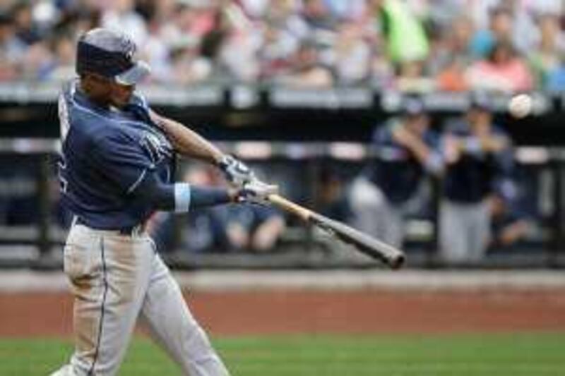 Tampa Bay Rays' B.J. Upton doubles to bring home two runs during the fifth inning of a baseball game against the New York Mets, Sunday, June 21, 2009, at Citi Field in New York. (AP Photo/Seth Wenig) *** Local Caption ***  NYM105_Rays_Mets_Baseball.jpg