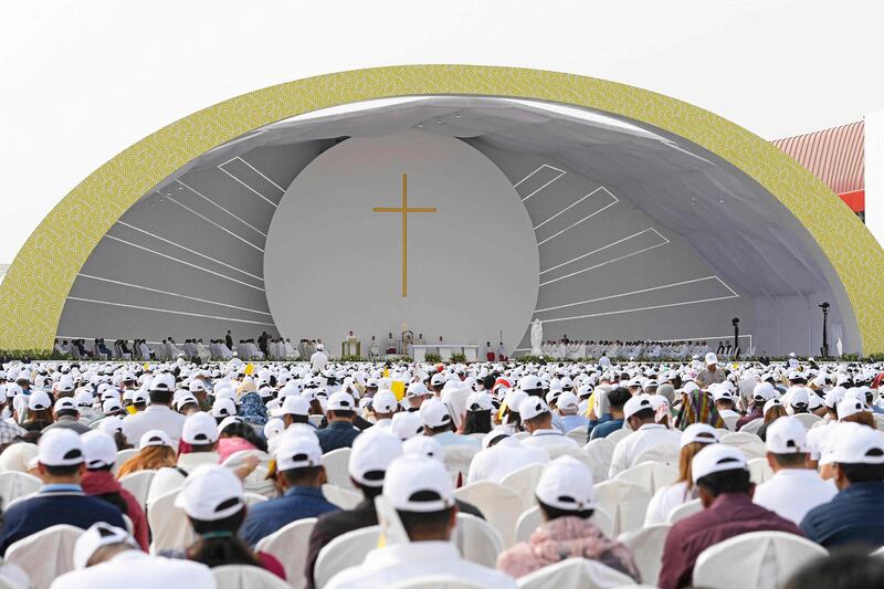 This handout photo released by the Vatican Media shows worshippers attending a mass held by Pope Francis at Bahrain National Stadium in Riffa, near the capital Manama. AFP