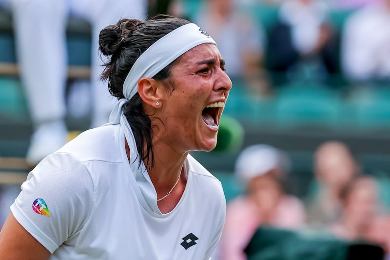 Ons Jabeur of Tunisia celebrates her victory over Elise Mertens of Belgium during their fourth-round match at the Wimbledon Championships. EPA