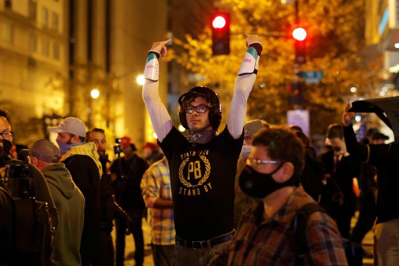 A member of far-right militia Proud Boys reacts during a scuffle following a protest against election results, in Washington, US. Reuters