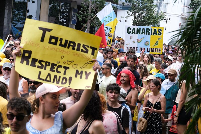 Protesters demand an urgent rethink of the Canary Islands' tourism model and freezing the number of tourists, in Santa Cruz de Tenerife, Spain. EPA