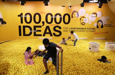 Visitors inside a yellow ball pit in the German pavilion at Expo 2020 in Dubai. Pawan Singh / The National  