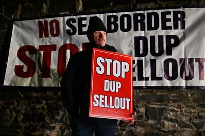Unionist protestors demonstrate against a possible DUP decision to return to power sharing. Getty Images 
