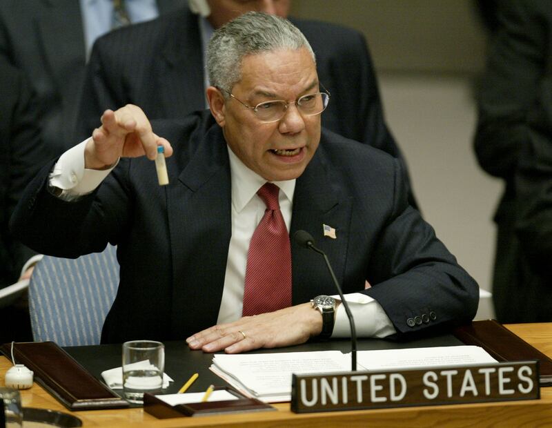 Powell holds up a vial that he described as one that could contain anthrax, during his presentation on Iraq to the UN Security Council in New York, February 2003.  Reuters