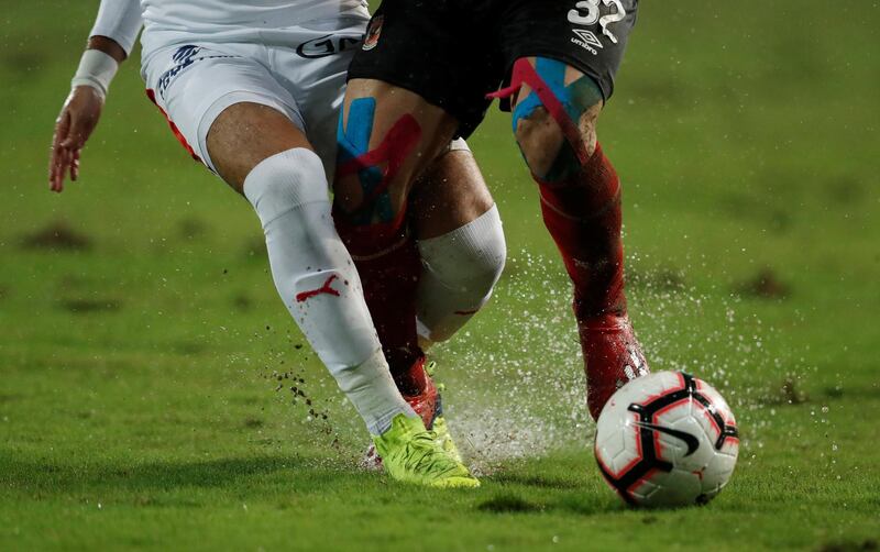 The rain-soaked pitch during the match. Reuters