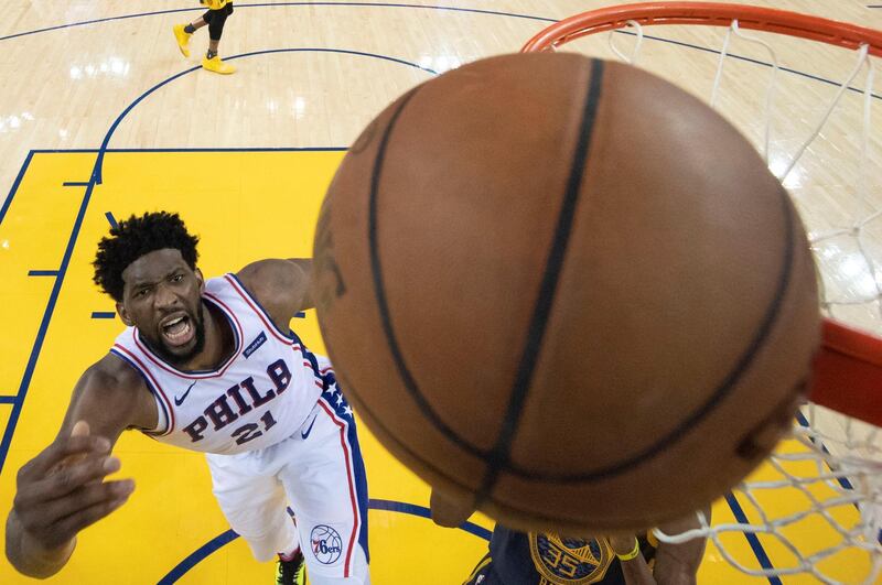 Philadelphia 76ers centre Joel Embiid  shoots the basketball against the Golden State Warriors at Oracle Arena. Reuters