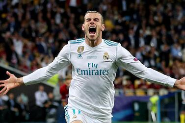 FILE PHOTO: ON THIS DAY -- May 26 May 26, 2018 SOCCER - Real Madrid's Gareth Bale celebrates scoring their second goal in a 3-1 Champions League final win over Liverpool. Bale's brace and errors by Liverpool keeper Loris Karius gave the Spanish side a third straight title in the competition. Bale came on just past the hour with the score at 1-1 and after three minutes produced a bicycle kick finish and netted again with a speculative long-range effort that somehow went through the hands of the unfortunate Karius. The German keeper had earlier handed Real a 51st minute lead when he threw the ball straight at striker Karim Benzema and the ball rolled into the unguarded net off the Frenchman's leg. REUTERS/Hannah McKay/File photo