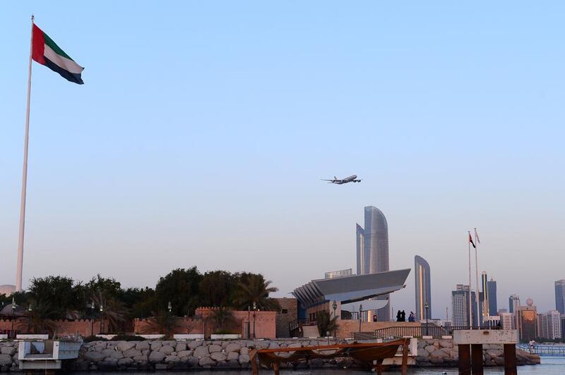 Etihad aircraft flying over the Abu Dhabi corniche in Abu Dhabi. Courtesy Etihad Airways