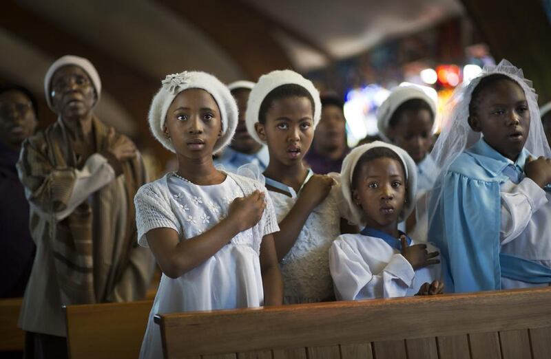 Young choristers attend a mass in memory of Nelson Mandela at the Regina Mundi church, which became one of the focal points of the anti-apartheid struggle, in Soweto, Johannesburg. Ben Curtis / AP

