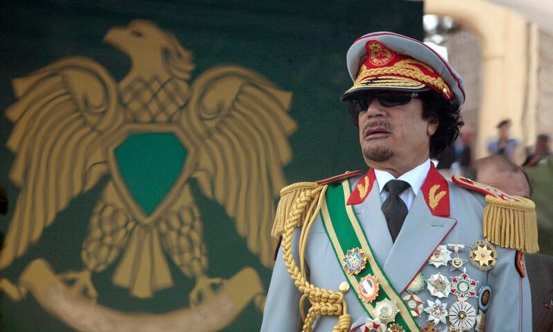 Libya's leader Muammar Gaddafi attends a celebration of the 40th anniversary of his coming to power at the Green Square in Tripoli in this September 1, 2009 file photo. Gaddafi died of wounds suffered in his capture near his hometown of Sirte on October 20, 2011, a senior NTC military official said. National Transitional Council official Abdel Majid Mlegta told Reuters earlier that Gaddafi was captured and wounded in both legs at dawn on Thursday as he tried to flee in a convoy which NATO warplanes attacked.    REUTERS/Zohra Bensemra/Files  (LIBYA - Tags: ANNIVERSARY POLITICS) *** Local Caption ***  SIN304_LIBYA_1020_11.JPG