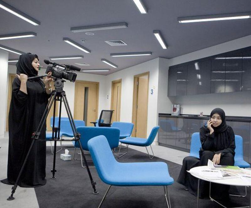 Students Sarah Matar, left, and Basima Salah, practise documentary filming techniques at the twofour54 office.
