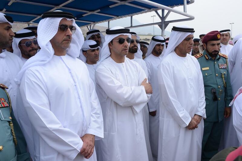 Sheikh Saif, Sheikh Hazza and Sheikh Saud during the burial of First Lt Al Shehi. Courtesy Security Media