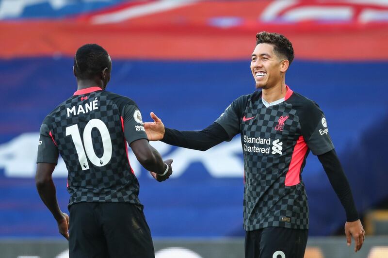 epa08893469 Roberto Firmino (R) of Liverpool celebrates with Sadio Mane (L) after scoring a goal during the English Premier League soccer match between Crystal Palace and Liverpool FC in London, Britain, 19 December 2020.  EPA/Clive Rose / POOL EDITORIAL USE ONLY. No use with unauthorized audio, video, data, fixture lists, club/league logos or 'live' services. Online in-match use limited to 120 images, no video emulation. No use in betting, games or single club/league/player publications.