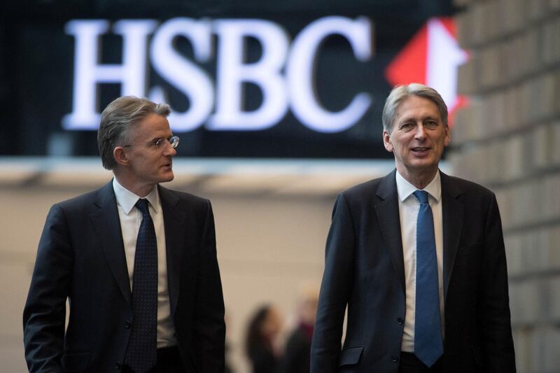 Britain's Finance Minister Philip Hammond, with CEO John Flint, arrives at HSBC to deliver a speech on Brexit at their headquarters in Canary Wharf in London, Britain, March 7, 2018. REUTERS/Stefan Rousseau/Pool