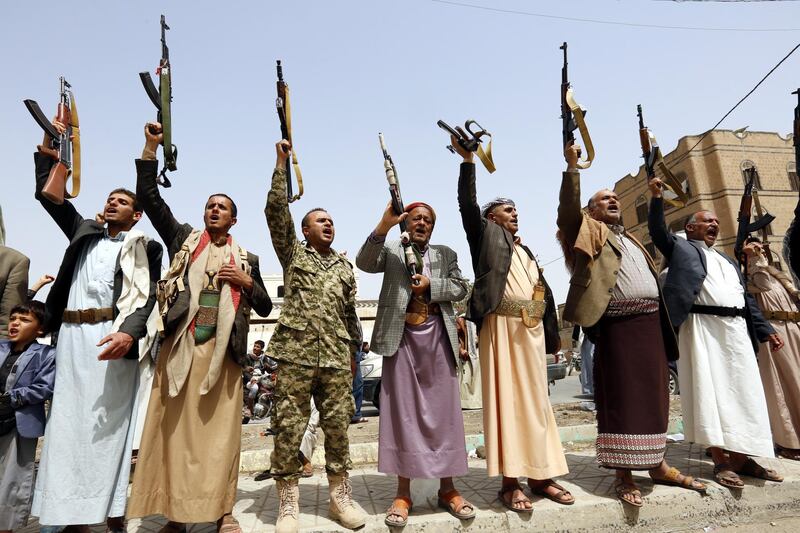 epa06838633 Supporters of Houthi rebels shout slogans and hold up weapons during a gathering to mobilize more fighters into the port city of Hodeidah, in Sana'a, Yemen, 25 June 2018.  According to reports, the Saudi-led coalition intensified its three-year bombing campaign against several positions of the Houthi rebels and their allies in the port city of Hodeidah as the Houthi rebels continued to mobilize more tribal fighters into Hodeidah battlefront against Yemenâ€™s Saudi-backed government forces.  EPA/YAHYA ARHAB