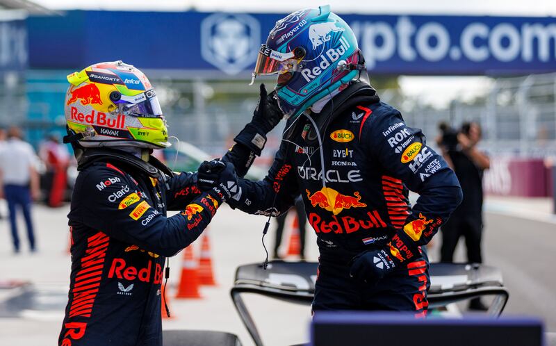 Red Bull driver Max Verstappen, right, celebrate with teammate Sergio Perez after the race. AFP
