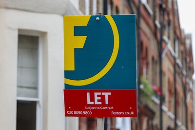 A Foxtons Group Plc estate agent "Let" sign outside a residential property in the Queen's Park district of London, UK. Photographer: Hollie Adams / Bloomberg