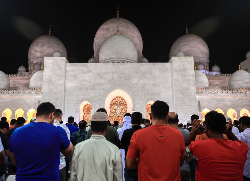 Worshippers offer isha prayers at the Sheikh Zayed Grand Mosque in Abu Dhabi. Victor Besa / The National