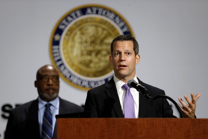 Hillsborough County State Attorney Andrew Warren, right, speaks during a news conference, in Tampa, Florida. AP Photo