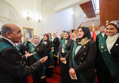 Mohamed Hossam El Din, head of the Council of State, speaks to newly appointed female judges of the State Lawsuits Authority after the swearing-in ceremony at the State Council headquarters in Giza, Egypt October 19, 2021. Reuters