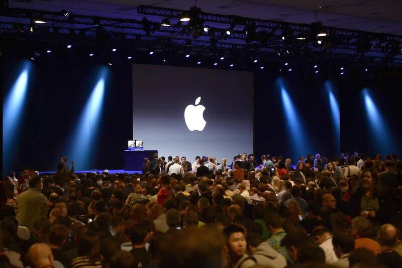 Attendees wait for the start of the keynote by Apple CEO Tim Cook at the Apple Worldwide Developers Conference. John Mabanglo / EPA